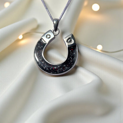 Midnight horseshoe ashes pendant in black flame, handcrafted in Lancashire UK - by Keepsake Memorial Jewellery