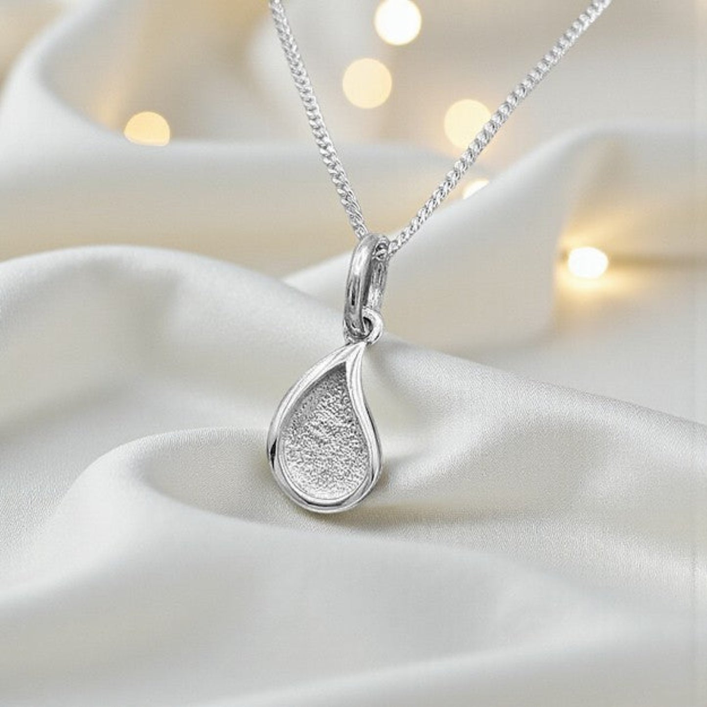 silver milk drop ashes memorial pendant, handcrafted in lancashire, uk