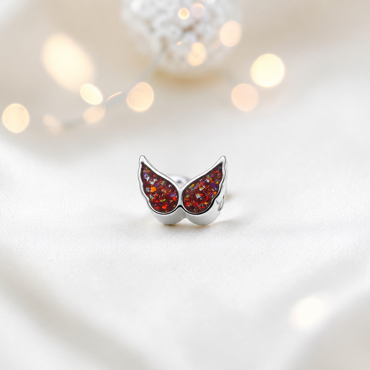 Copper mocha sterling silver angel wing ashes memorial charm, handcrafted in Lancashire by keepsake memorial
