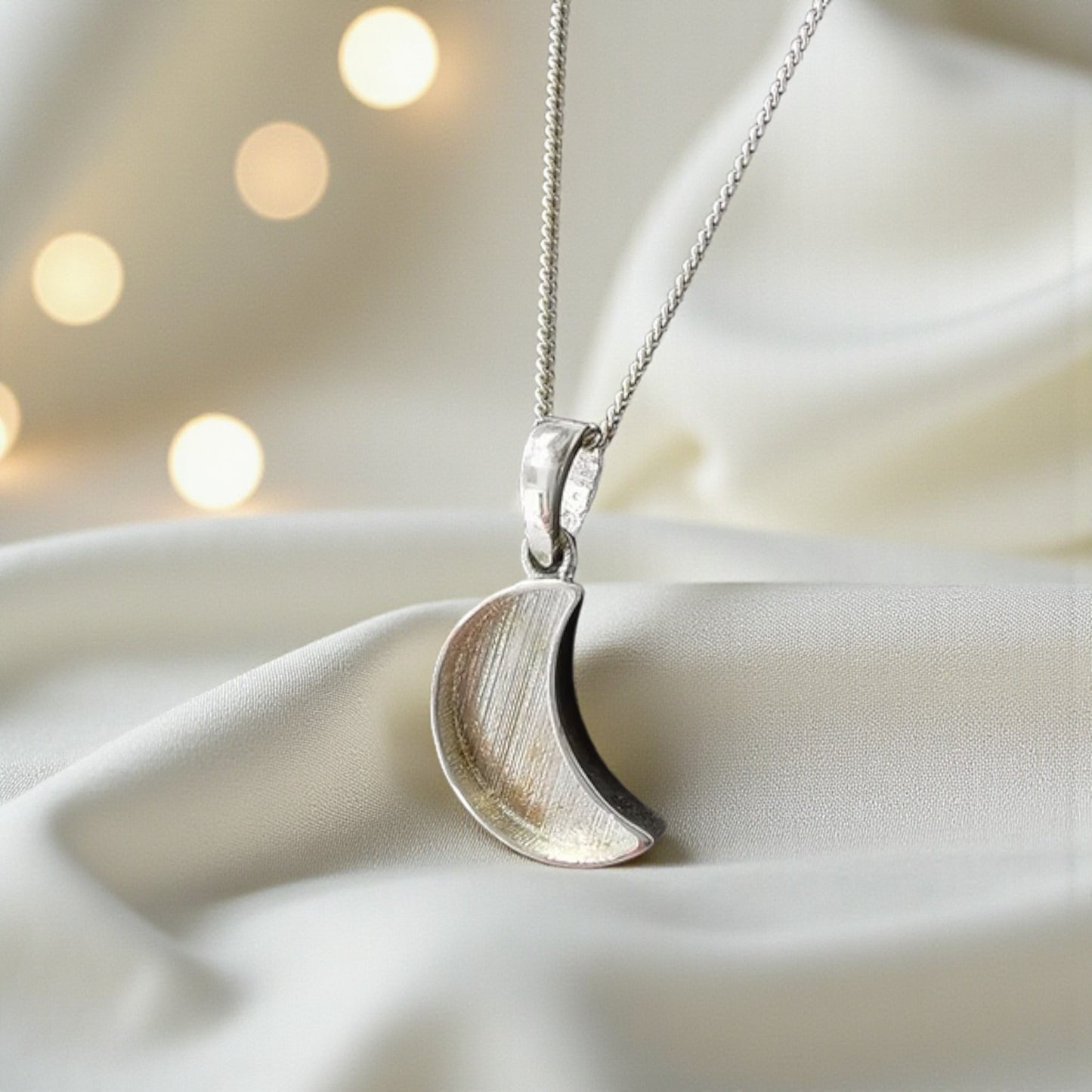 silver moon shaped pendant, handcrafted in lancashire, uk