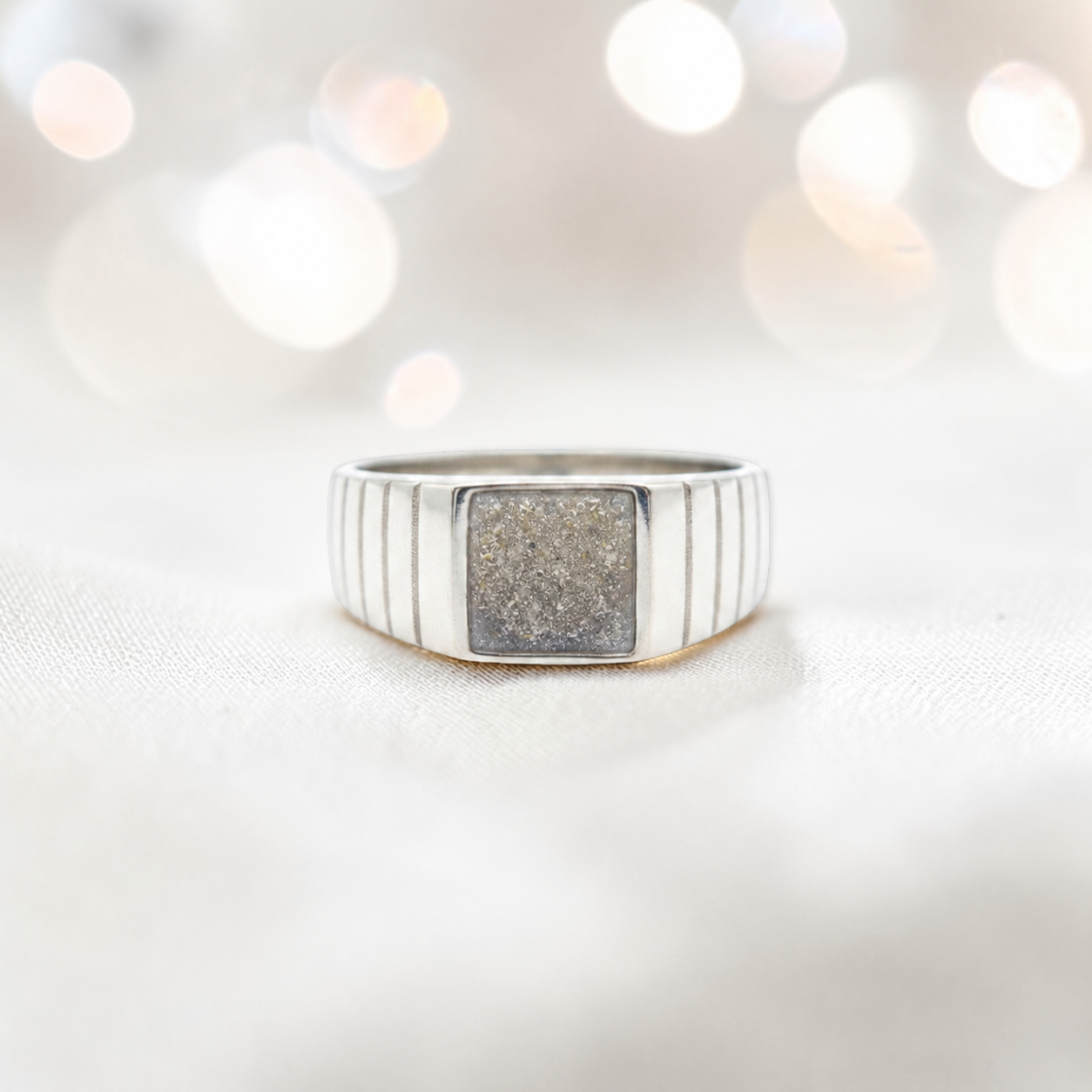 Natural ash Echo men's sterling silver memorial signet ring, handcrafted in Lancashire UK by Keepsake Memorial Jewellery