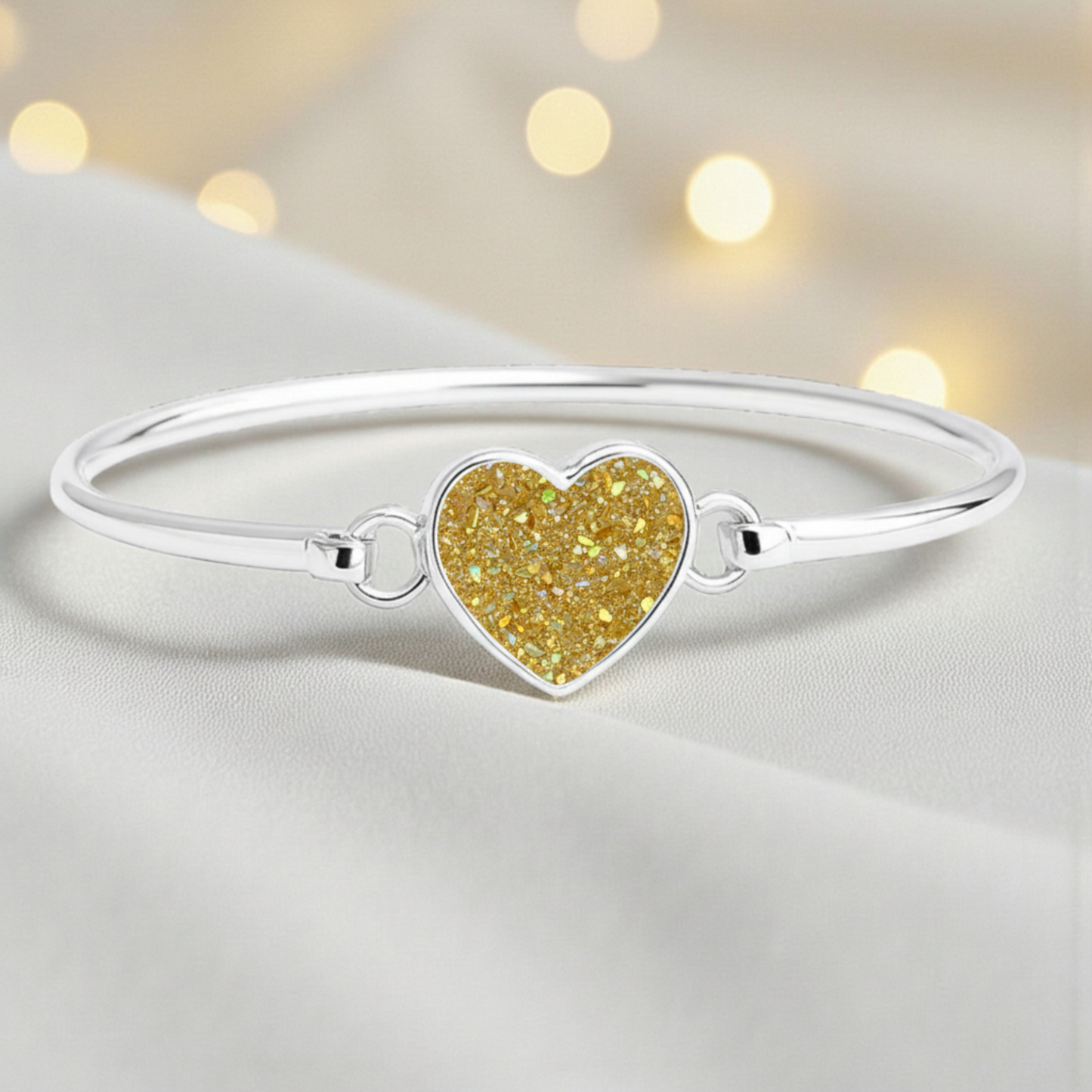 Nyx Bangle — silver ashes memorial bangle with gold olive opal, handcrafted in Lancashire, UK