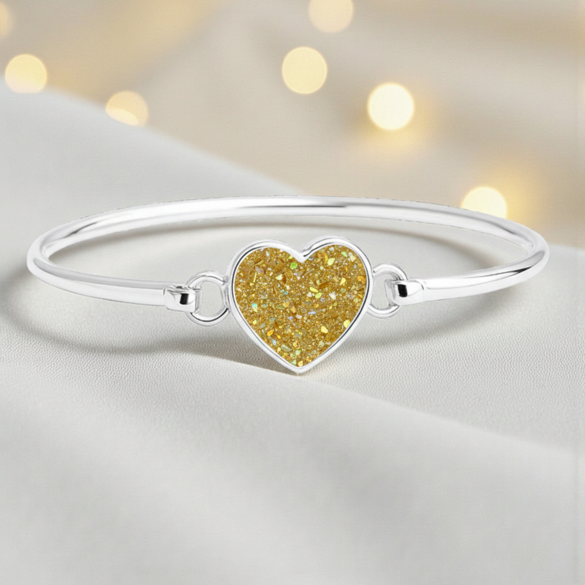 Nyx Bangle — silver ashes memorial bangle with gold olive opal, handcrafted in Lancashire, UK