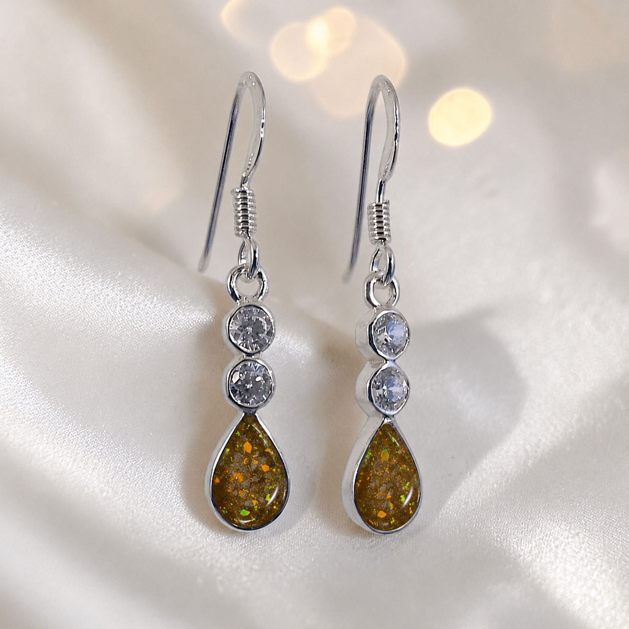 Acrux Earrings — silver pear drop ashes memorial earrings in Gold Olive resin, handcrafted in Lancashire, UK
