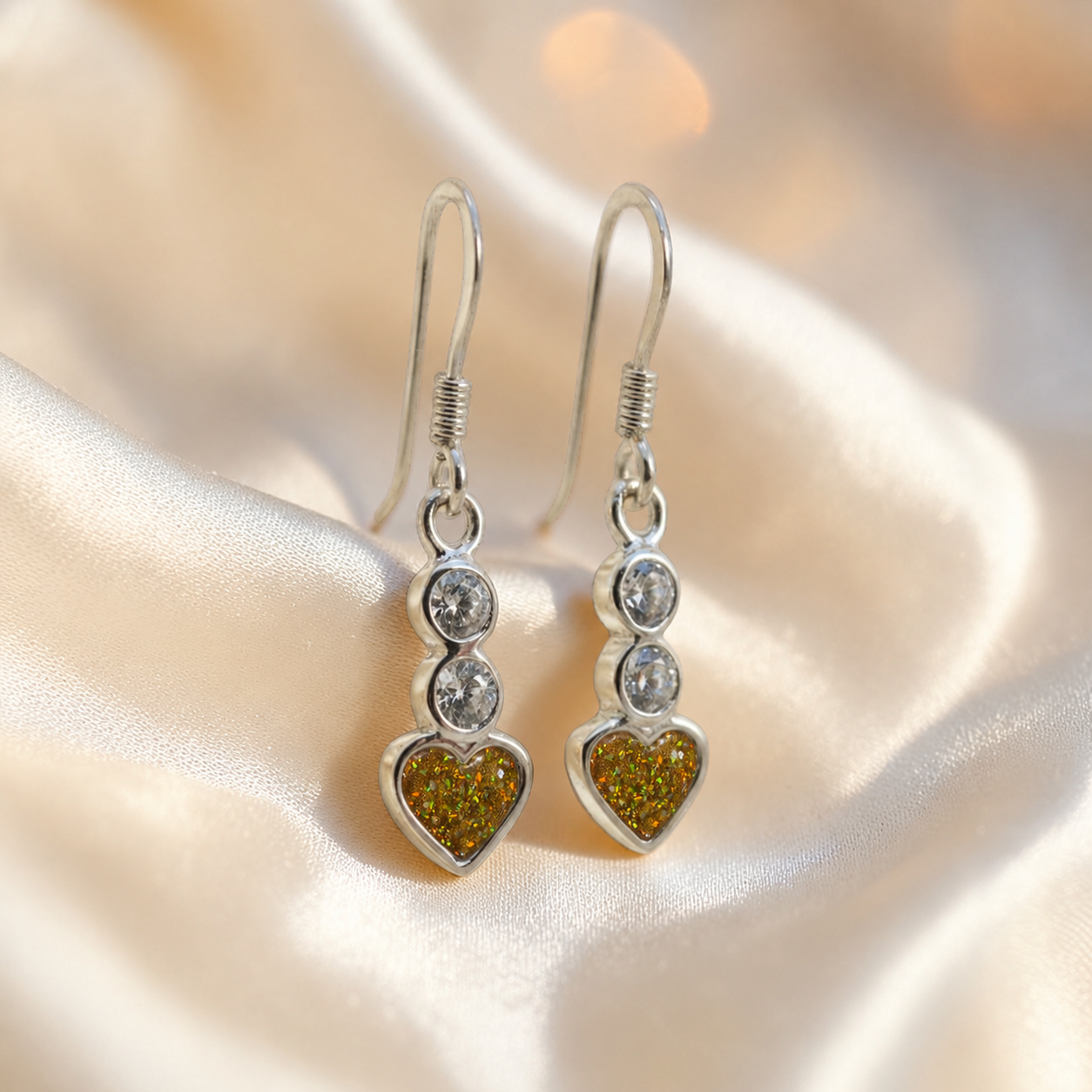 Pleione Earrings — silver heart drop ashes memorial earrings in Gold Olive resin, handcrafted in Lancashire, UK