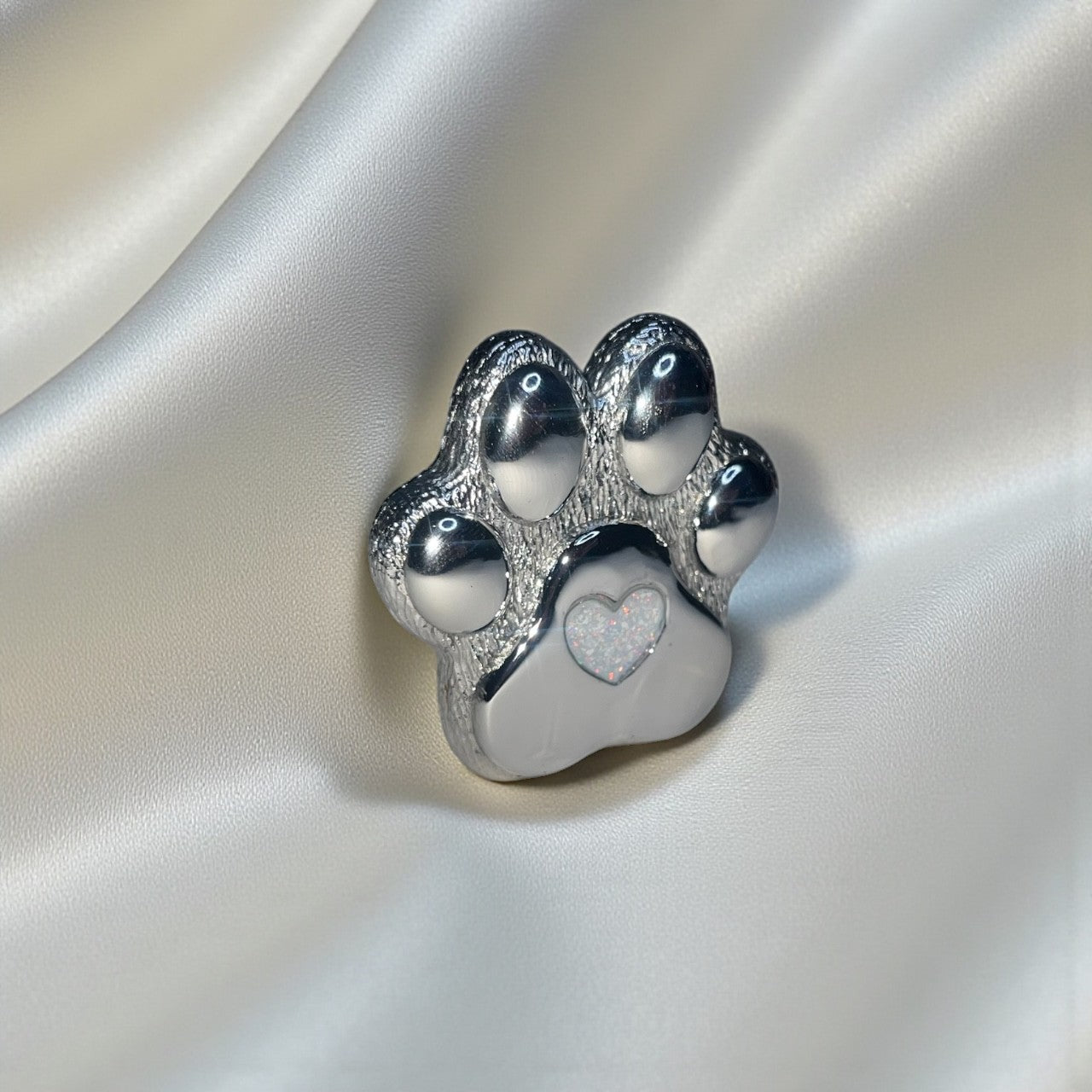 Stainless steel paw print memorial ornament, handcrafted in Lancashire