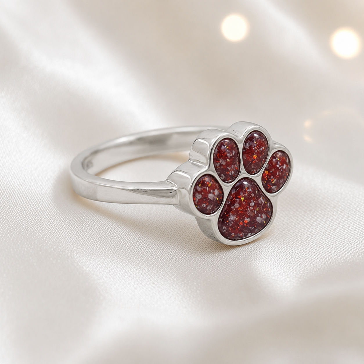 Silver Starlight paw ashes ring in ruby red, handcrafted in Lancashire UK - by Keepsake Memorial Jewellery