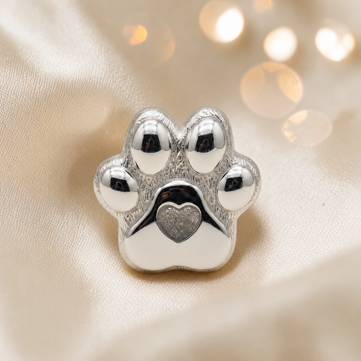 Pawprint of love, Stainless steel paw print ashes ornament in natural ash, handcrafted in Lancashire, UK - by Keepsake Memorial Jewellery