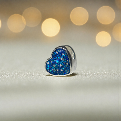 Peaceful heart charm, sterling silver ashes heart charm in sapphire glow, handcrafted in Lancashire UK