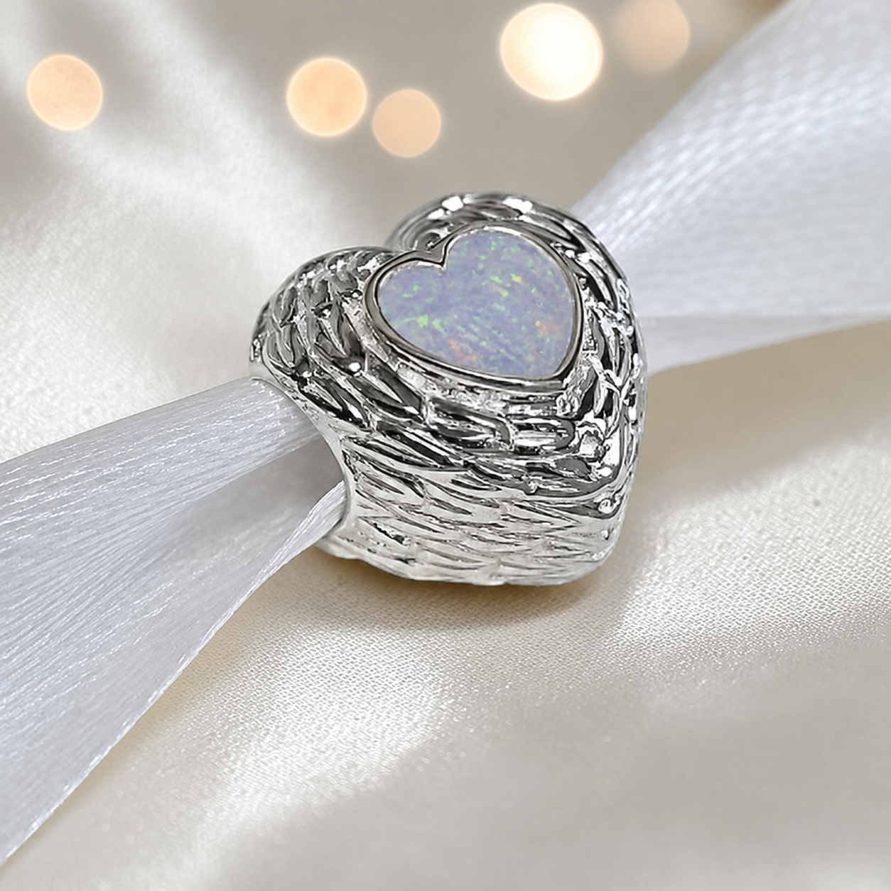 White snow sterling silver peaceful whisper heart ashes memorial charm, handcrafted in Lancashire by keepsake memorial