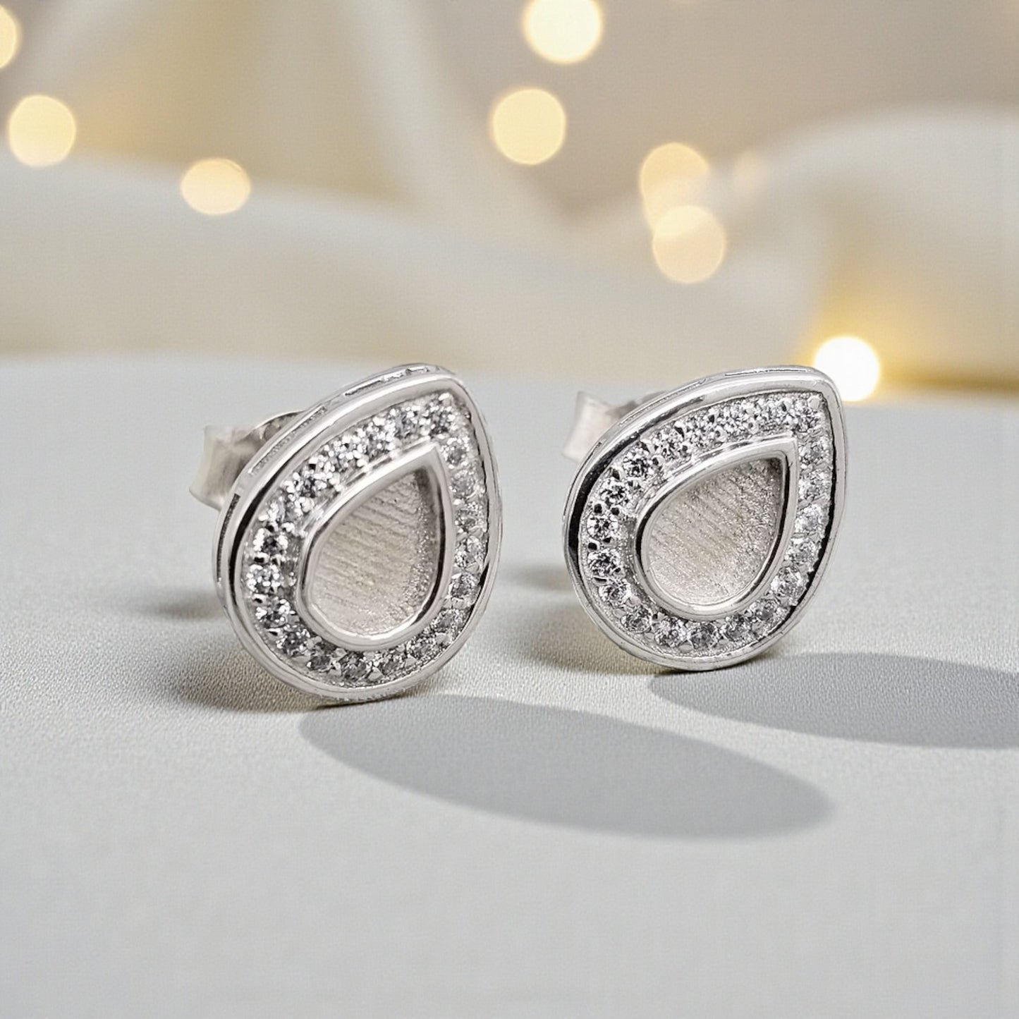 Seraph Glow Earrings — silver pear CZ ashes memorial earrings, handcrafted in Lancashire, UK