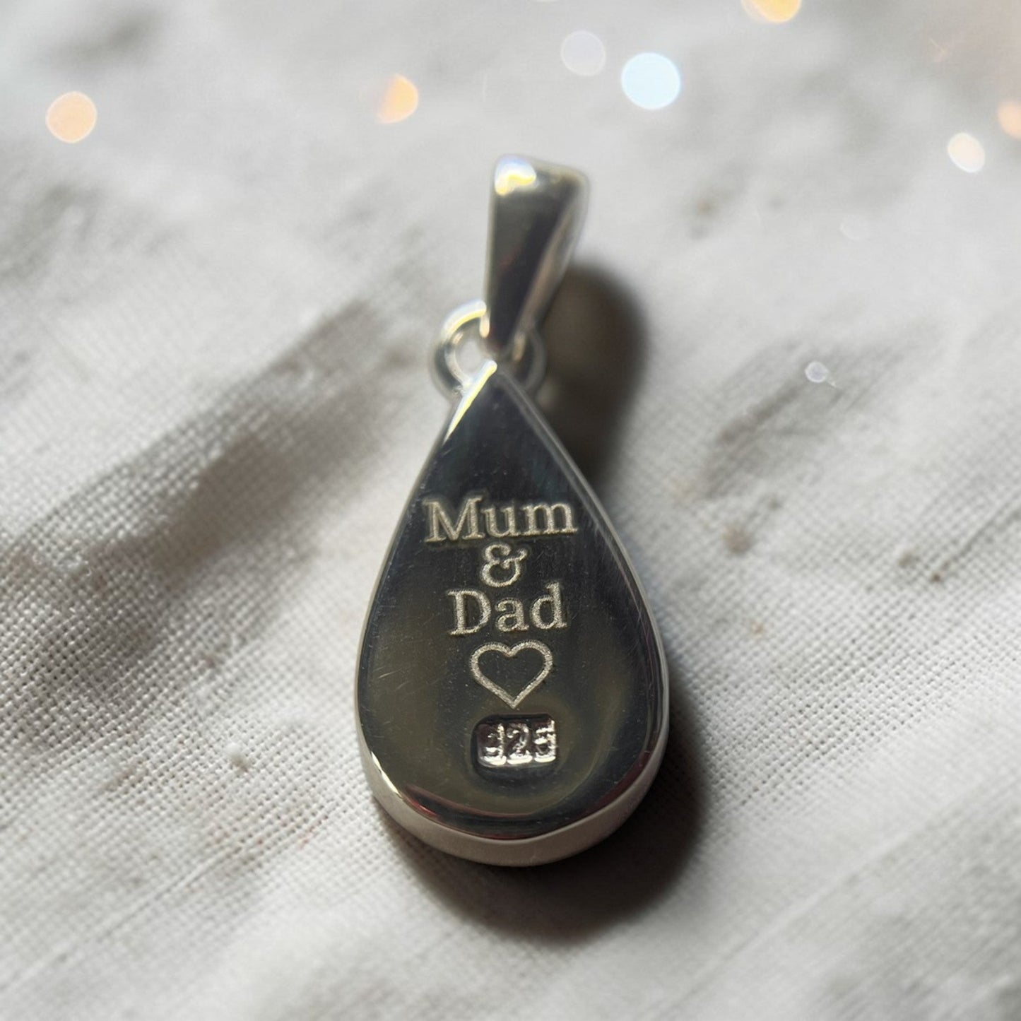 engraving on rear of vega pendant, memorial uk