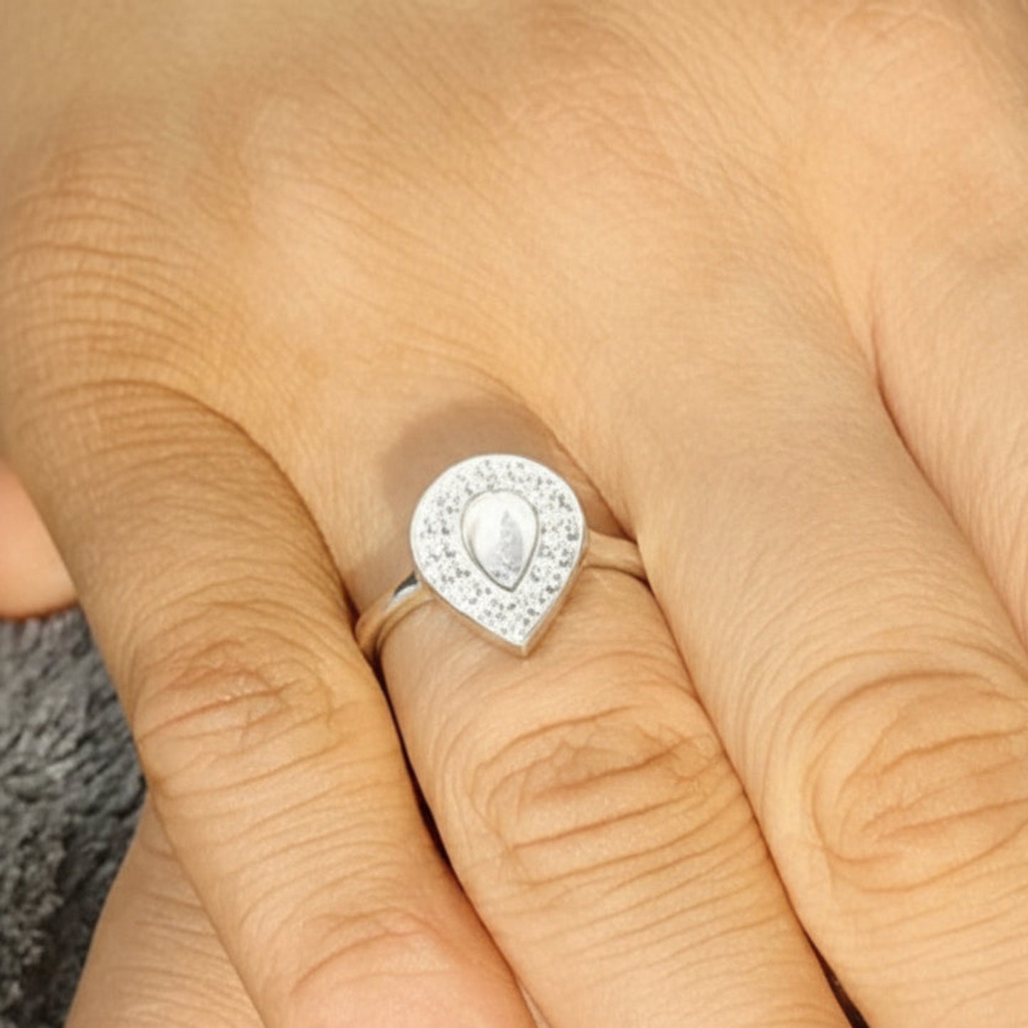 Helena Ring worn on hand — silver pear CZ ashes memorial ring, handcrafted in the UK