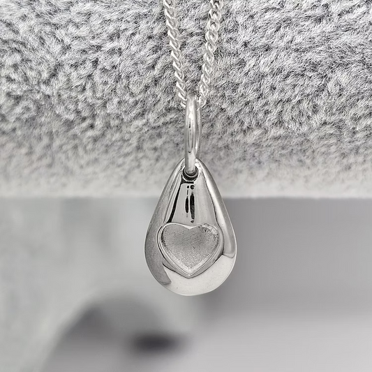 Silver pebble memorial pendant, handcrafted in Lancashire, UK