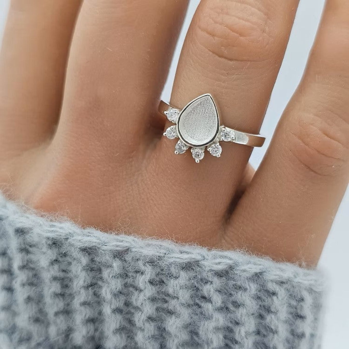 Eternelle Ring worn on hand — silver raindrop CZ ashes memorial ring, handcrafted in the UK