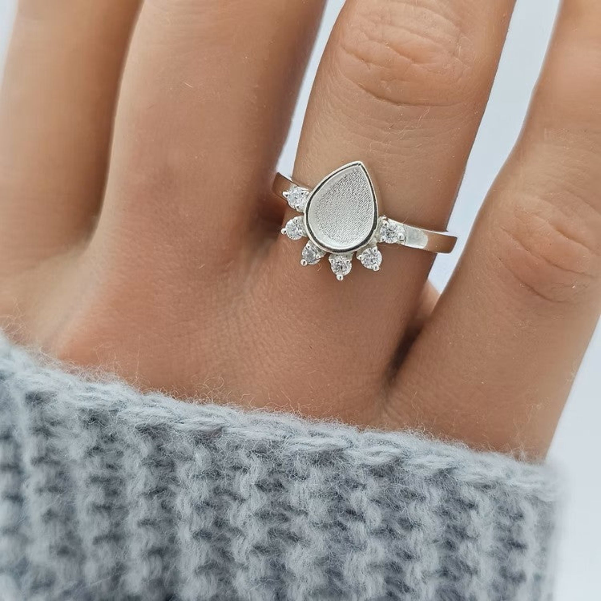 Eternelle Ring worn on hand — silver raindrop CZ ashes memorial ring, handcrafted in the UK