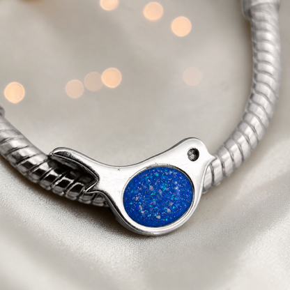 Keepsake memorial silver Robin  ashes charm, in royal blue, handcrafted in Lancashire, UK