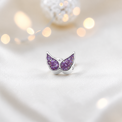 Rose pink sterling silver angel wing ashes memorial charm, handcrafted in Lancashire by keepsake memorial