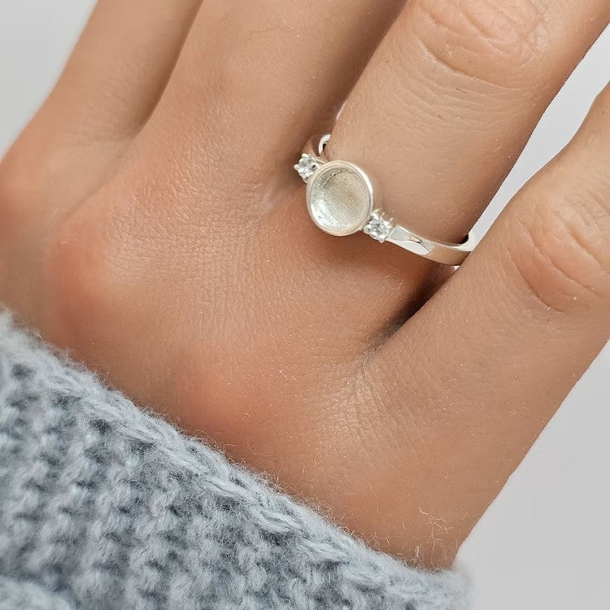 Azrael Ring worn on hand — silver round double gem ashes memorial ring, handcrafted in the UK