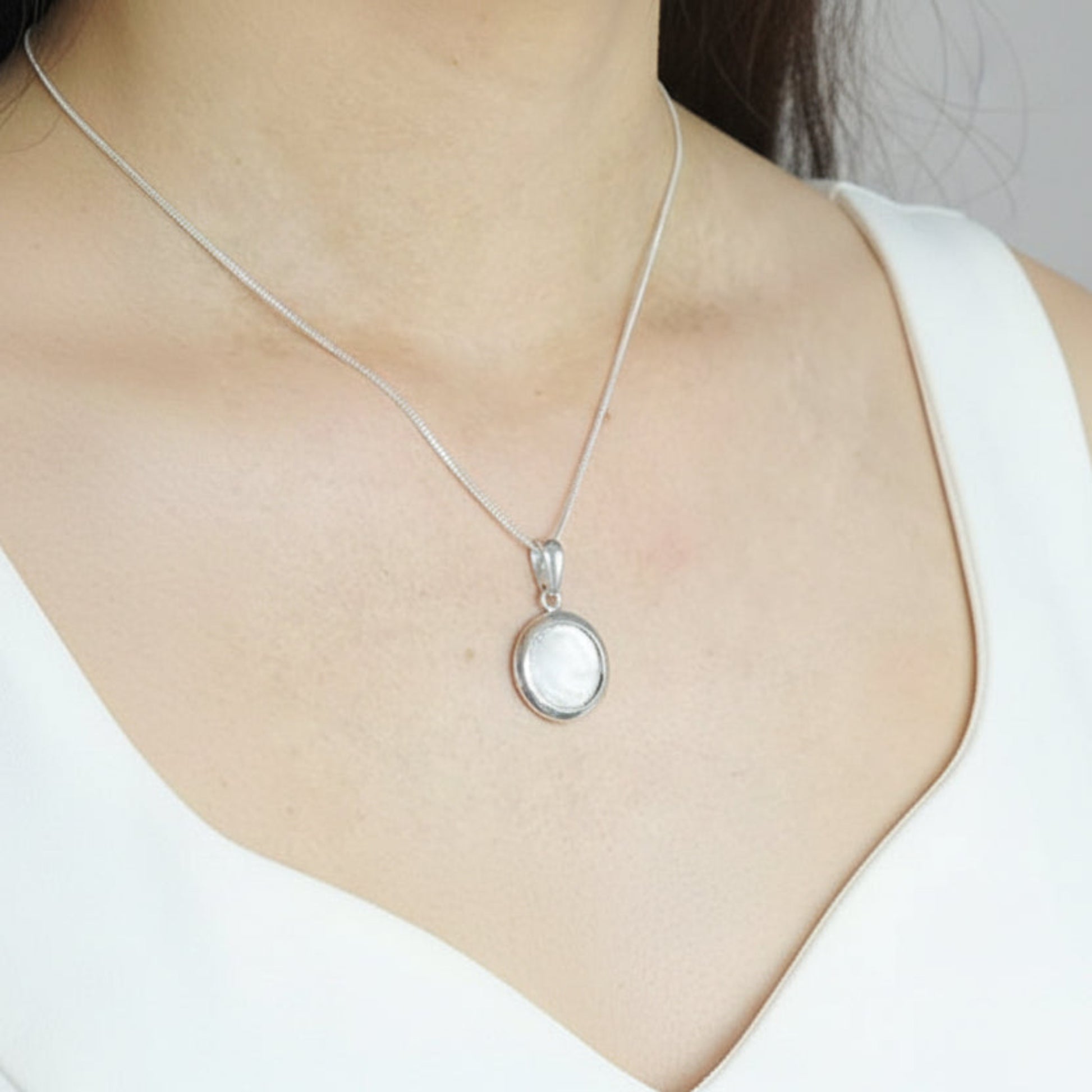 silver round memory pendant, handcrafted in rossendale