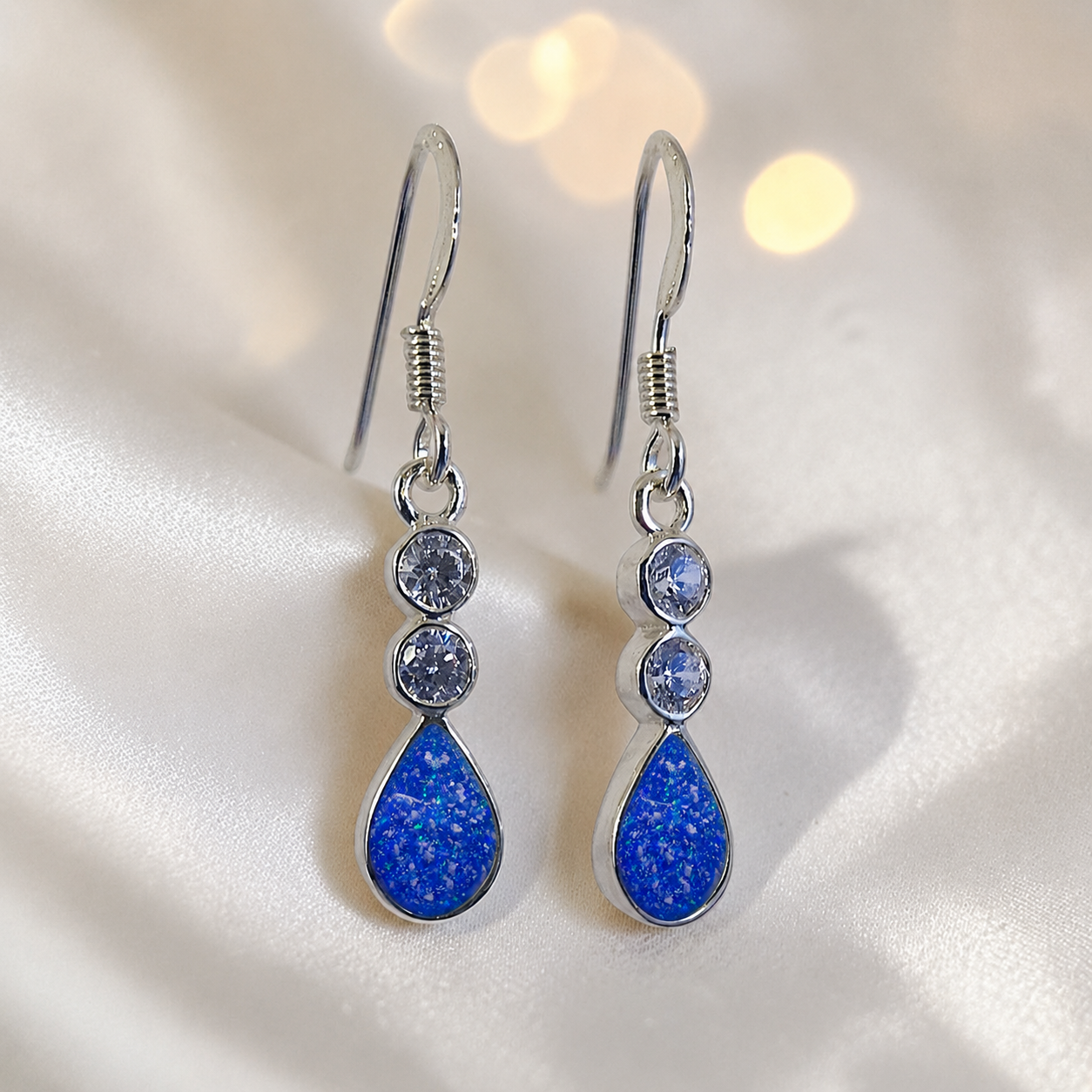 Acrux Earrings — silver pear drop ashes memorial earrings in Royal Blue resin, handcrafted in Lancashire, UK