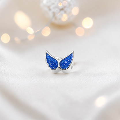 Royal blue sterling silver angel wing ashes memorial charm, handcrafted in Lancashire by keepsake memorial