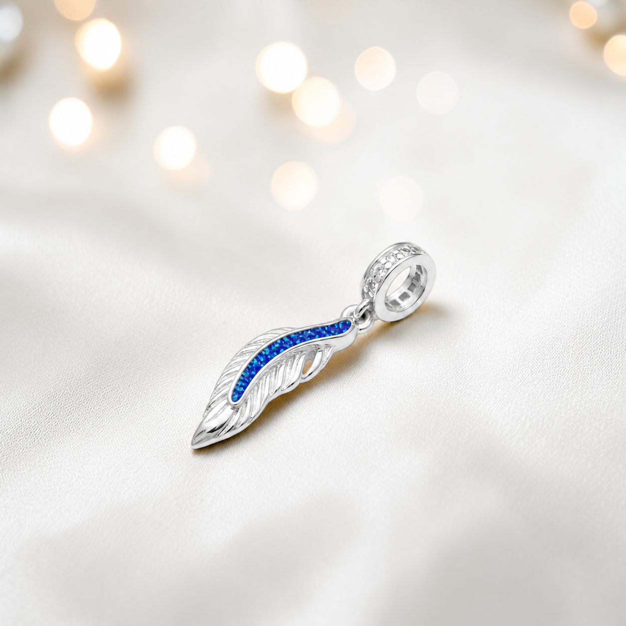 Royal blue sterling silver heavens feather  ashes memorial dangle  charm, handcrafted in Lancashire by keepsake memorial