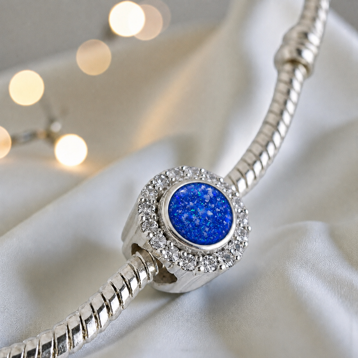 Royal Blue sterling silver halo ashes memorial charm, handcrafted in Lancashire by keepsake memorial