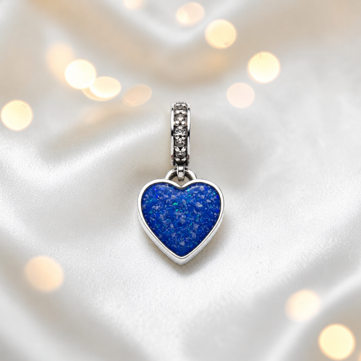 Royal blue sterling silver heavens heart ashes memorial dangle  charm, handcrafted in Lancashire by keepsake memorial