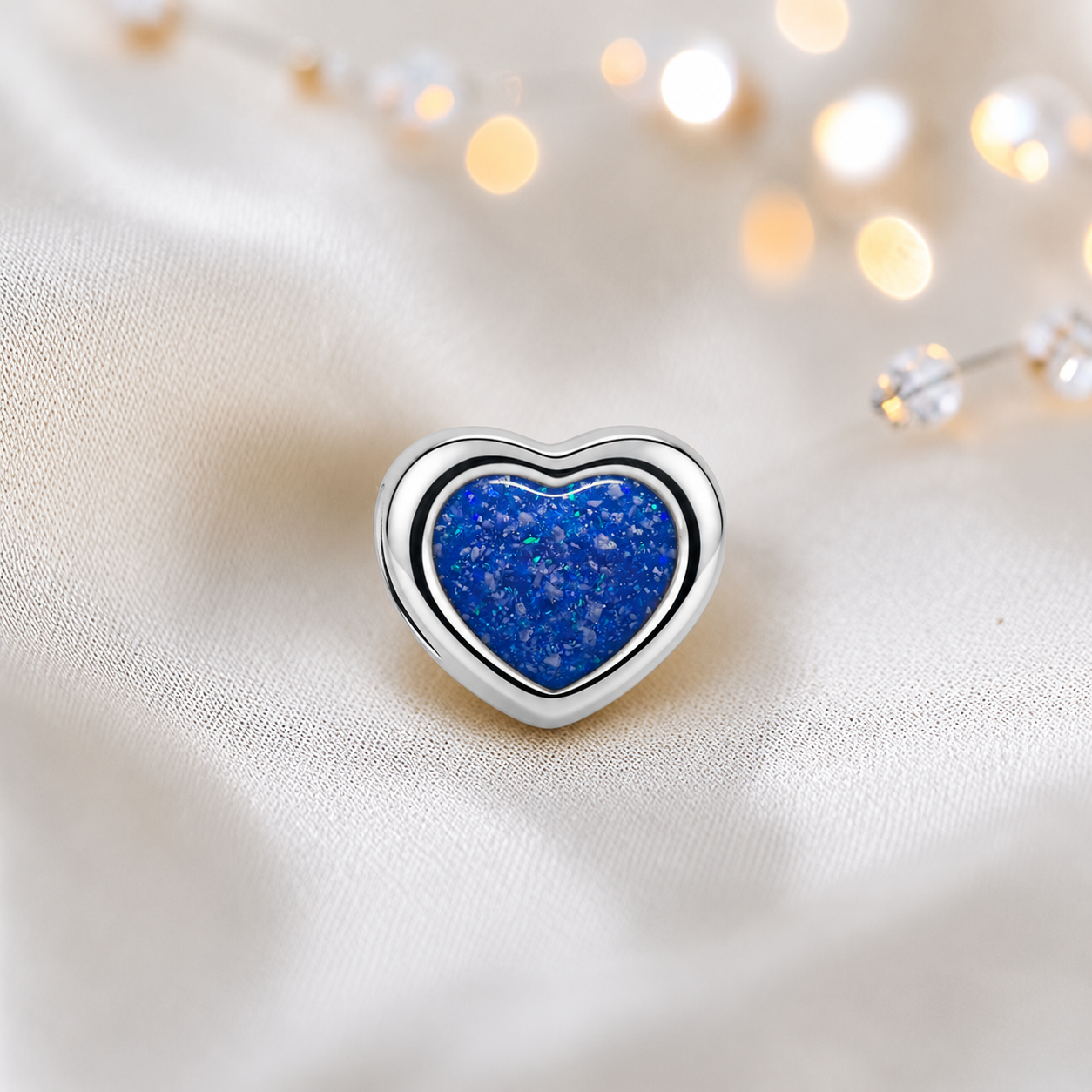 Royal blue sterling silver peaceful heart ashes memorial charm, handcrafted in Lancashire by keepsake memorial