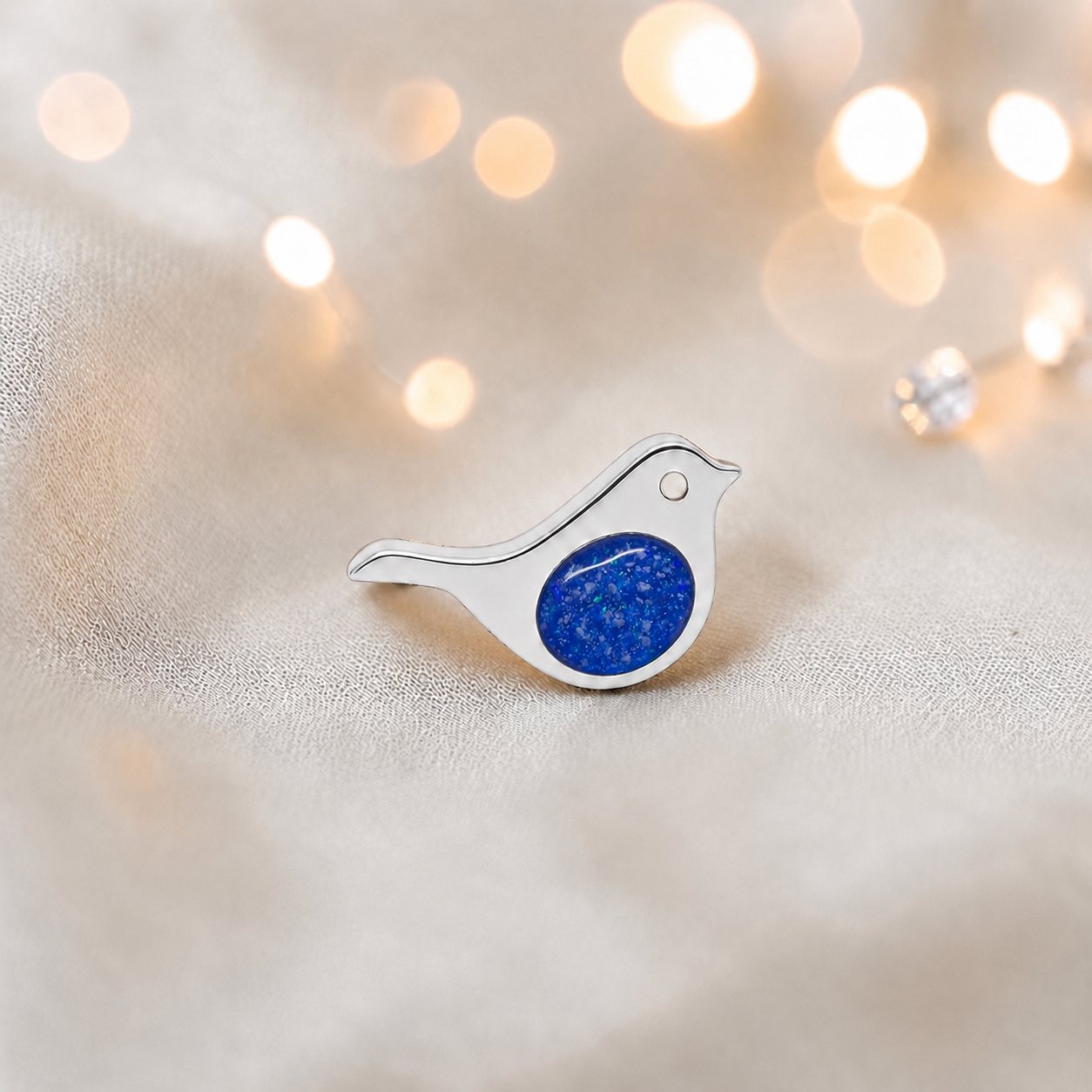 Keepsake memorial silver Robin  ashes charm, in royal blue, handcrafted in Lancashire, UK
