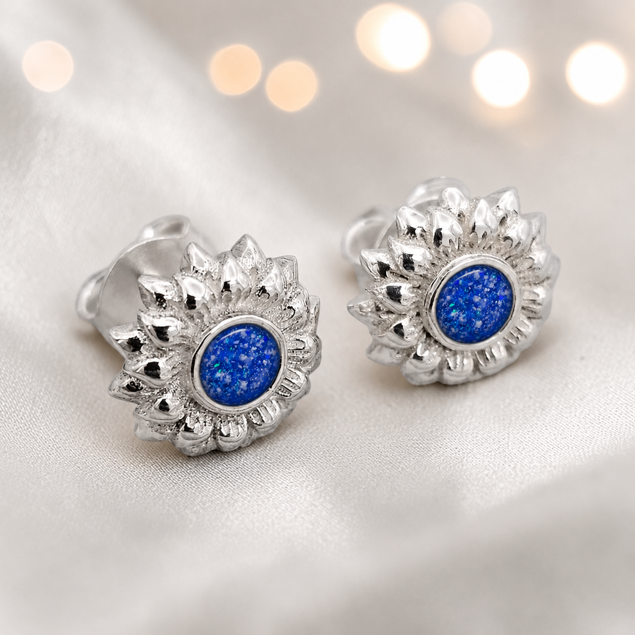 Flora Earrings — silver sunflower ashes memorial stud earrings in Royal Blue resin, handcrafted in Lancashire, UK
