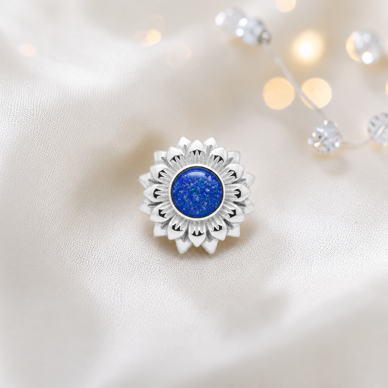 Royal blue sterling silver sunflower ashes memorial charm, handcrafted in Lancashire by keepsake memorial