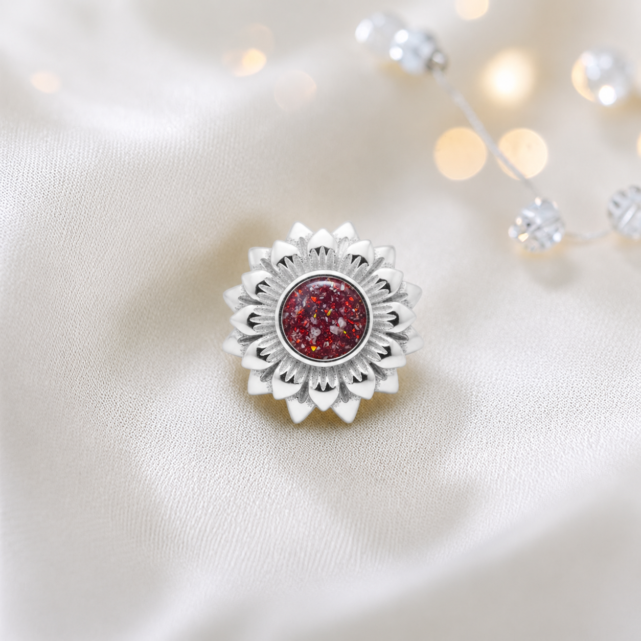 Ruby red sterling silver sunflower ashes memorial charm, handcrafted in Lancashire by keepsake memorial