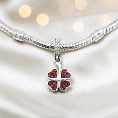 Ruby red sterling silver clover dangle ashes memorial charm, handcrafted in Lancashire by keepsake memorial
