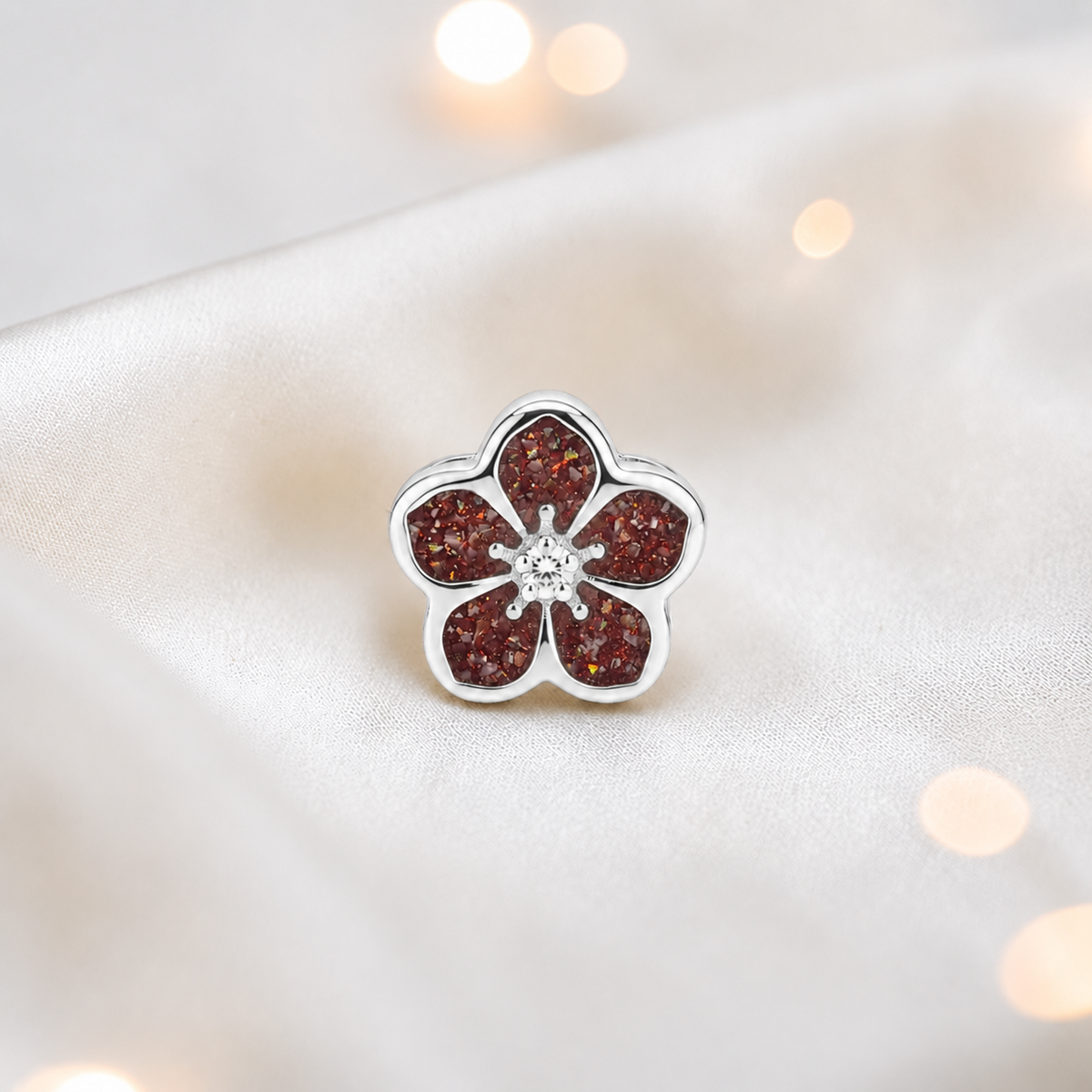 Ruby red sterling silver forget me not ashes memorial charm, handcrafted in Lancashire by keepsake memorial