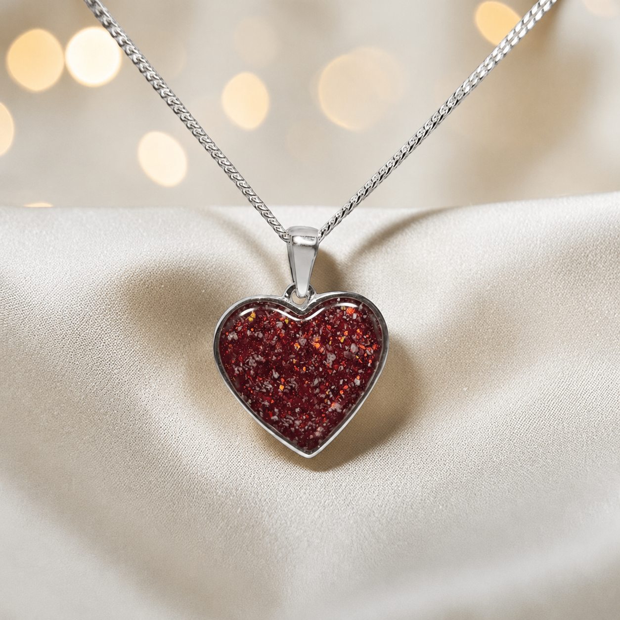 Silver Betel heart ashes memorial pendant in Ruby Red, handcrafted in Lancashire UK