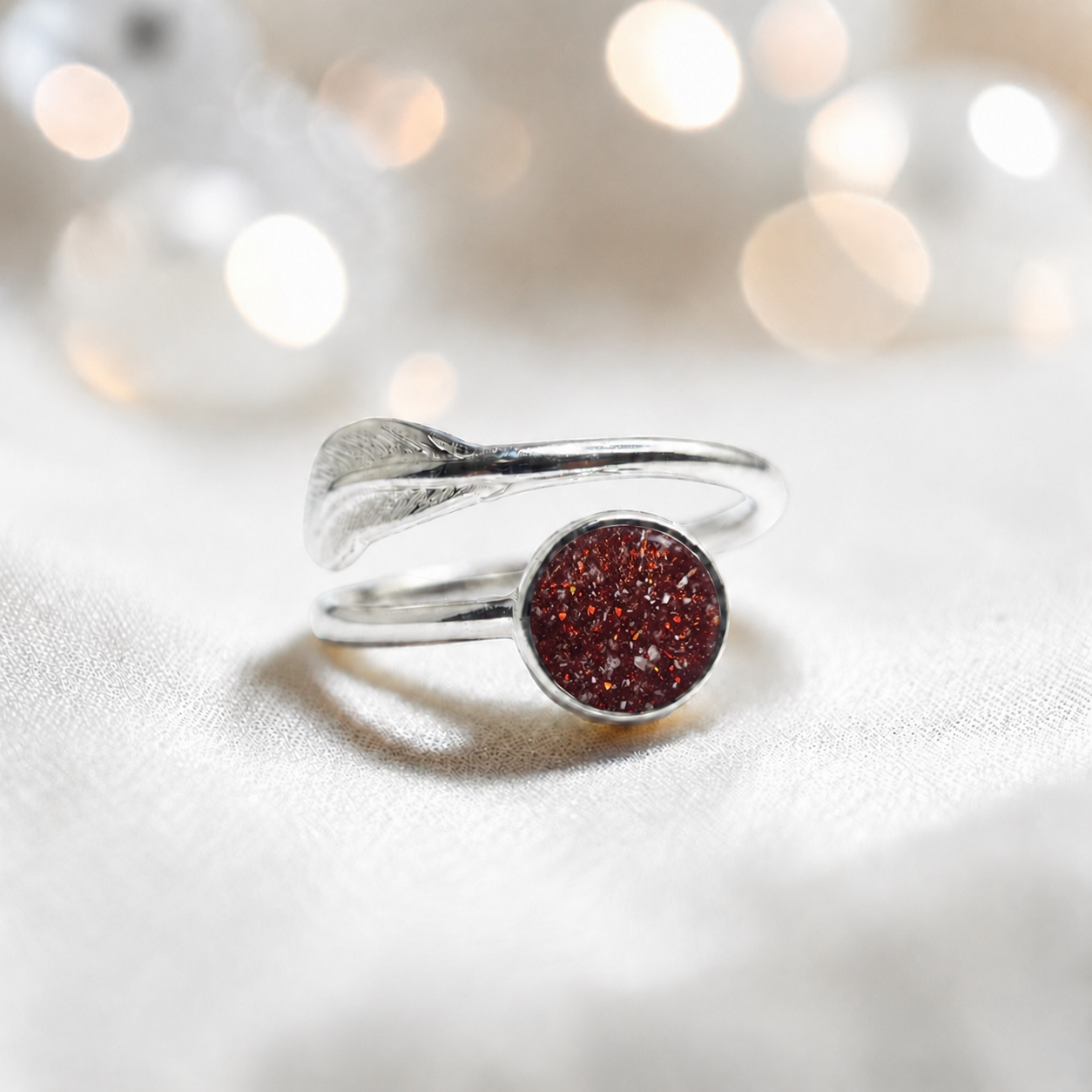 Feather Whisper Ring — silver feather ashes memorial ring, in ruby red, handcrafted in Lancashire, UK