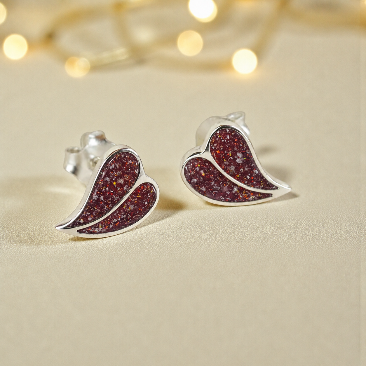 Two Hearts memorial stud earrings in Ruby Red opal — sterling silver, handcrafted in Lancashire, UK