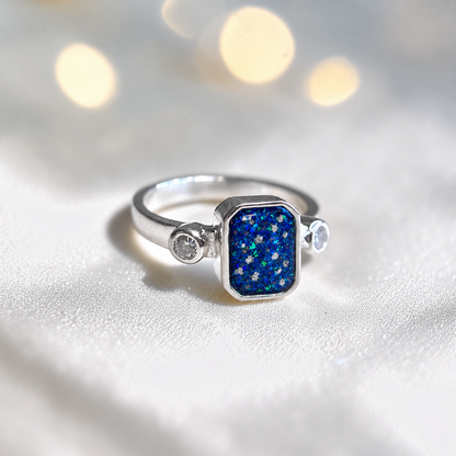 Keepsake Memorial Silver Anastasia Emerald Cut Ashes Ring in Sapphire Glow — handcrafted in Lancashire, UK