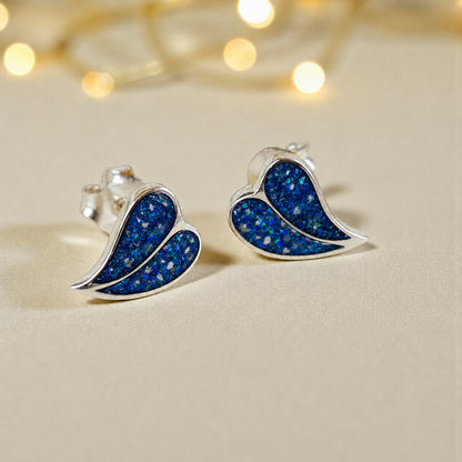 Two Hearts memorial stud earrings in Sapphire Glow opal — sterling silver, handcrafted in Lancashire, UK