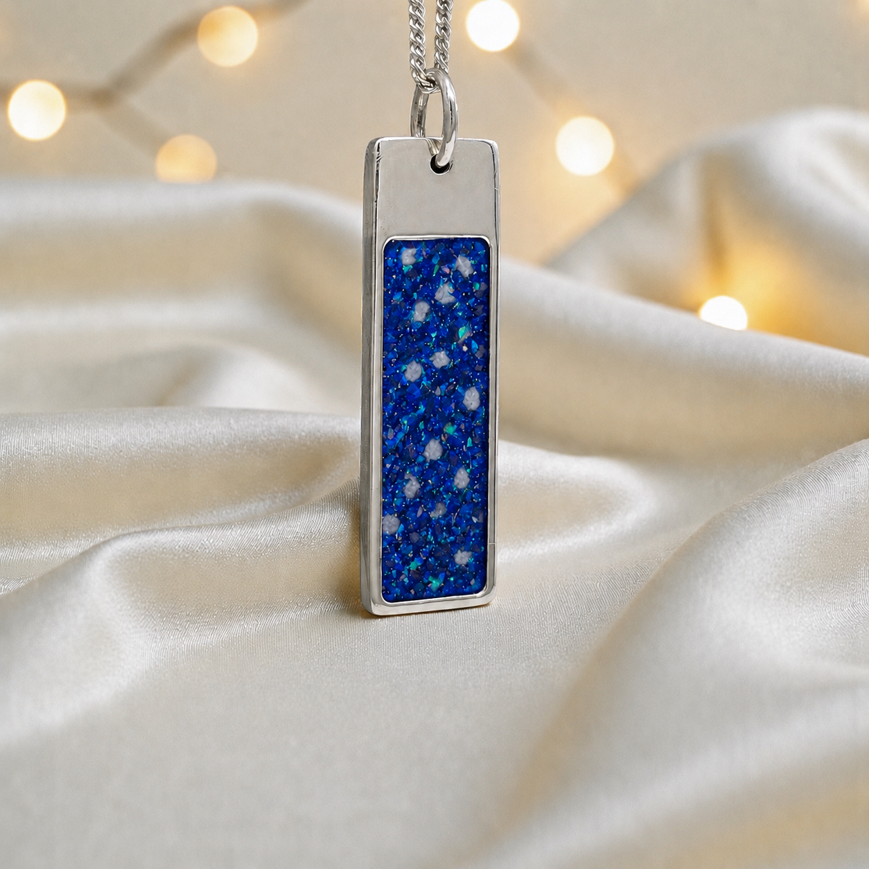 Sapphire glow Valour men's sterling silver memorial pendant, handcrafted in Lancashire UK by Keepsake Memorial Jewellery