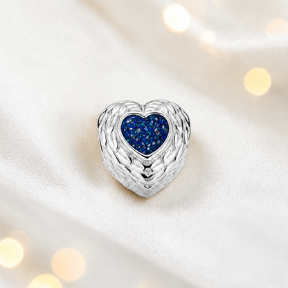 Sapphire glow sterling silver peaceful whisper heart ashes memorial charm, handcrafted in Lancashire by keepsake memorial