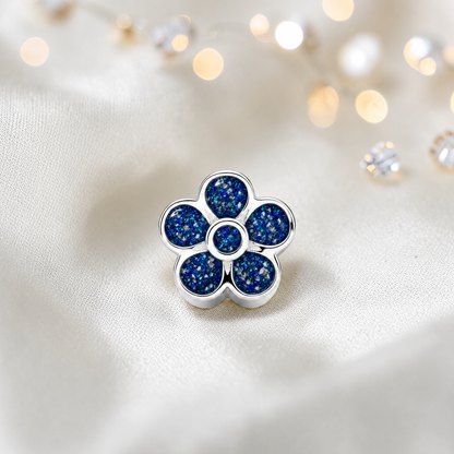 Sapphire glow sterling silver flora, flower ashes memorial charm, handcrafted in Lancashire by keepsake memorial