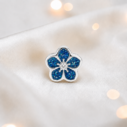 Sapphire glow sterling silver forget me not ashes memorial charm, handcrafted in Lancashire by keepsake memorial
