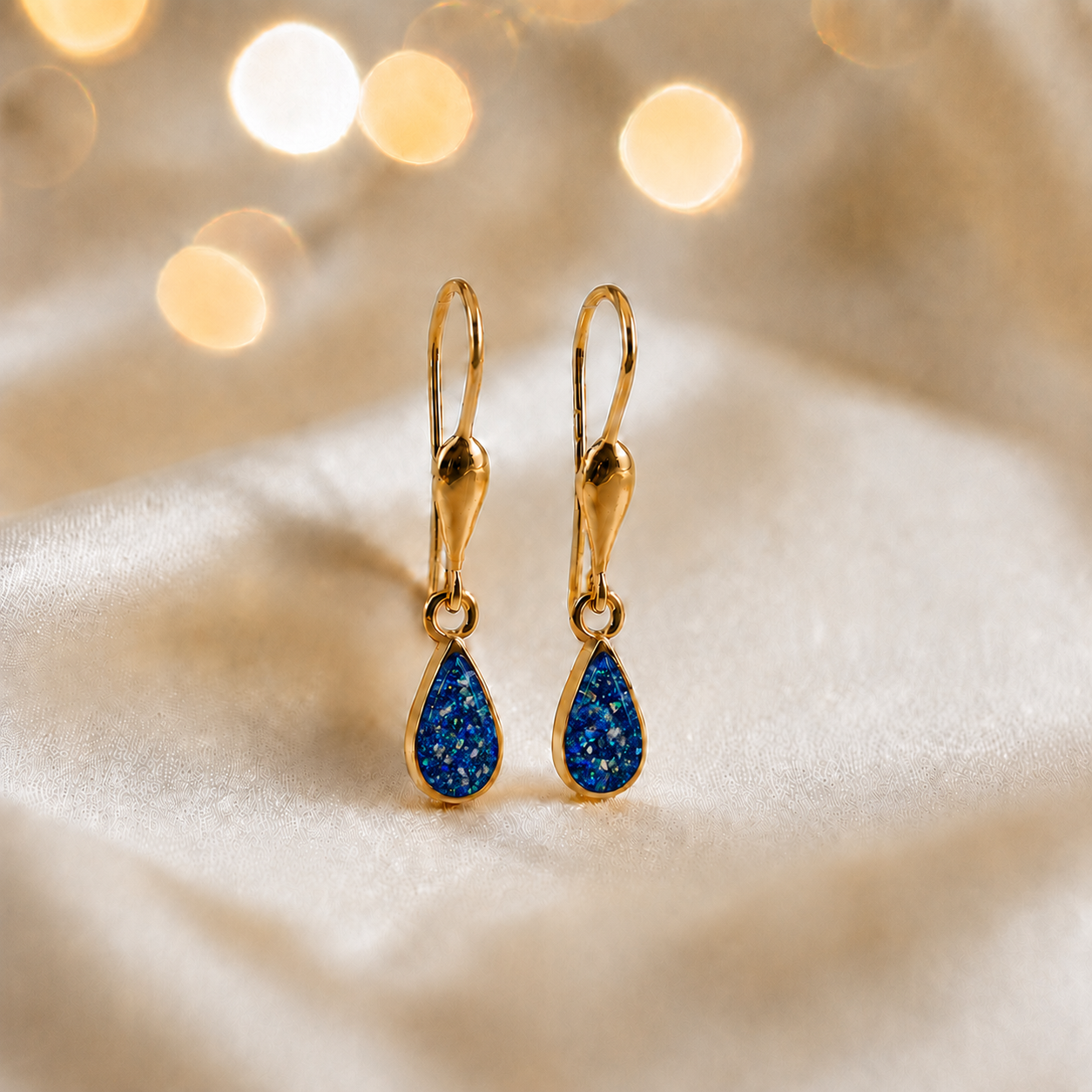 Sapphire glow Calla 9ct gold drop memorial earrings, handcrafted in Lancashire, UK – by Keepsake Memorial Jewellery