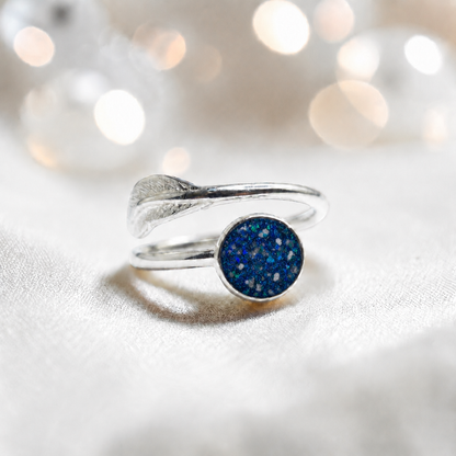 Feather Whisper Ring — silver feather ashes memorial ring, in sapphire glow, handcrafted in Lancashire, UK