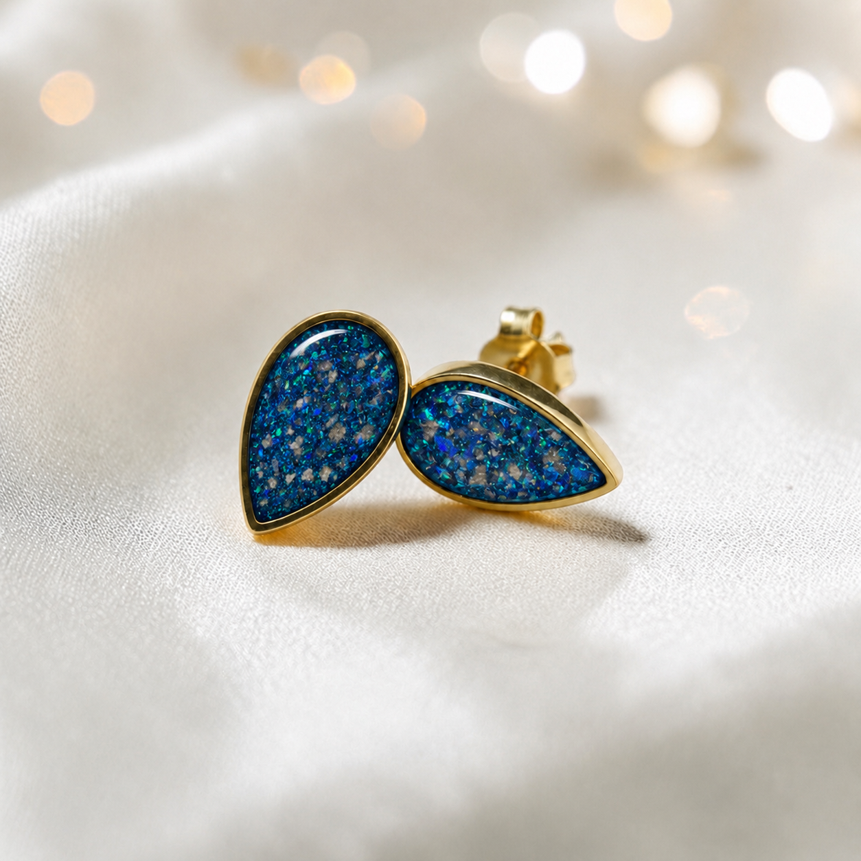 Sapphire Glow Luma 9ct gold pear drop earrings, handcrafted in Lancashire, UK – by Keepsake Memorial Jewellery