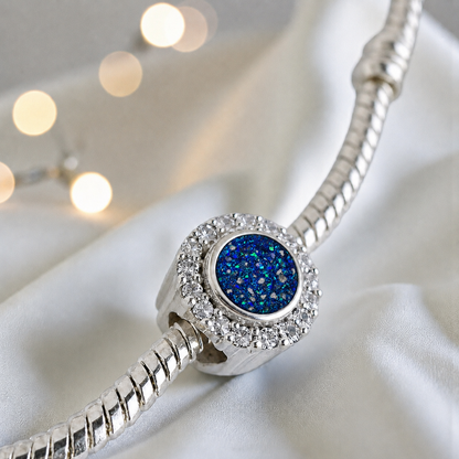 Sapphire glow sterling silver halo ashes memorial charm, handcrafted in Lancashire by keepsake memorial
