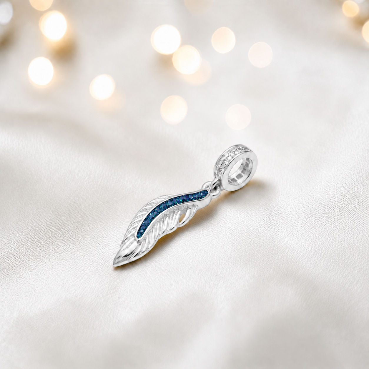 Sapphire glow sterling silver heavens feather  ashes memorial dangle  charm, handcrafted in Lancashire by keepsake memorial